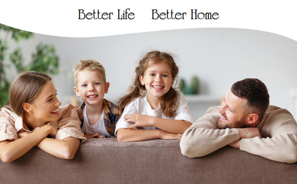 A family members looking at each other smiling on the couch.