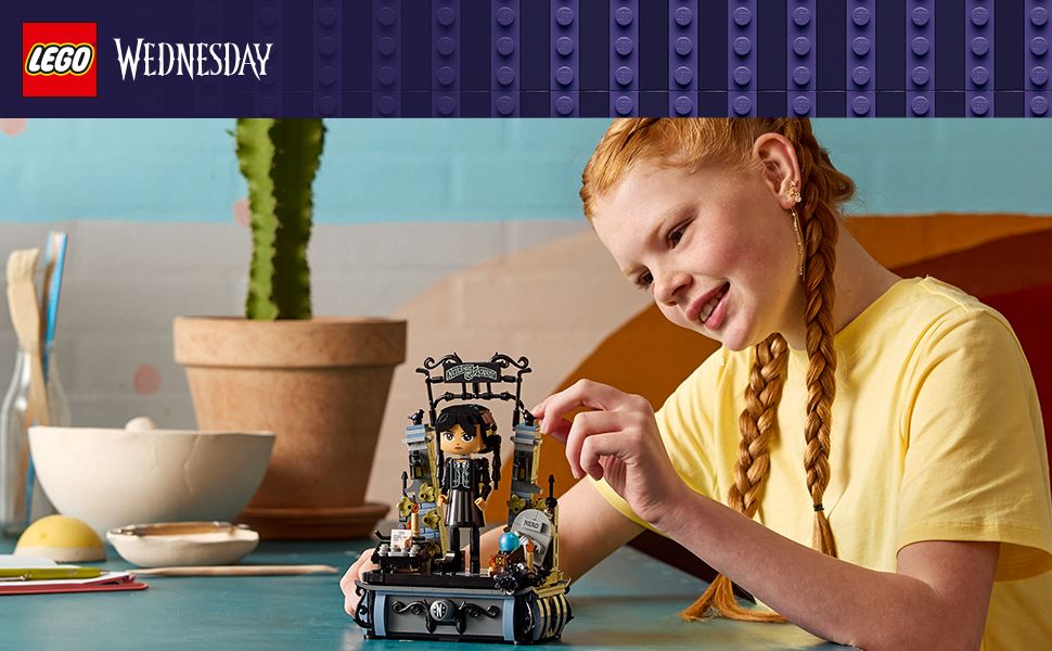 Girl playing with Wednesday Addams figure building set